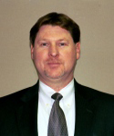 Dan Kessler assistant director of Transportation in a dark suit and tie