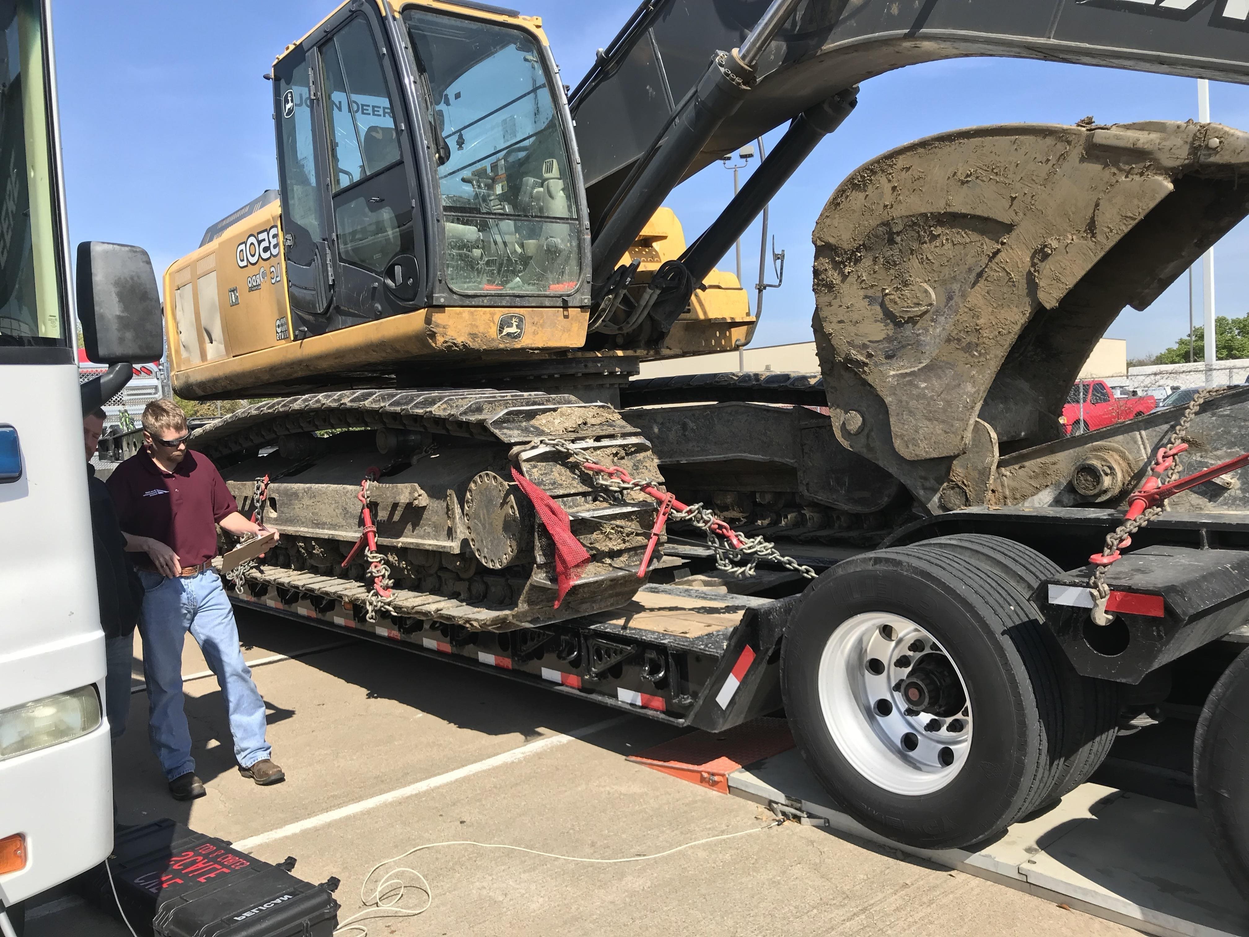 Heavy-duty vehicle with large cargo to be weighed at weigh station.