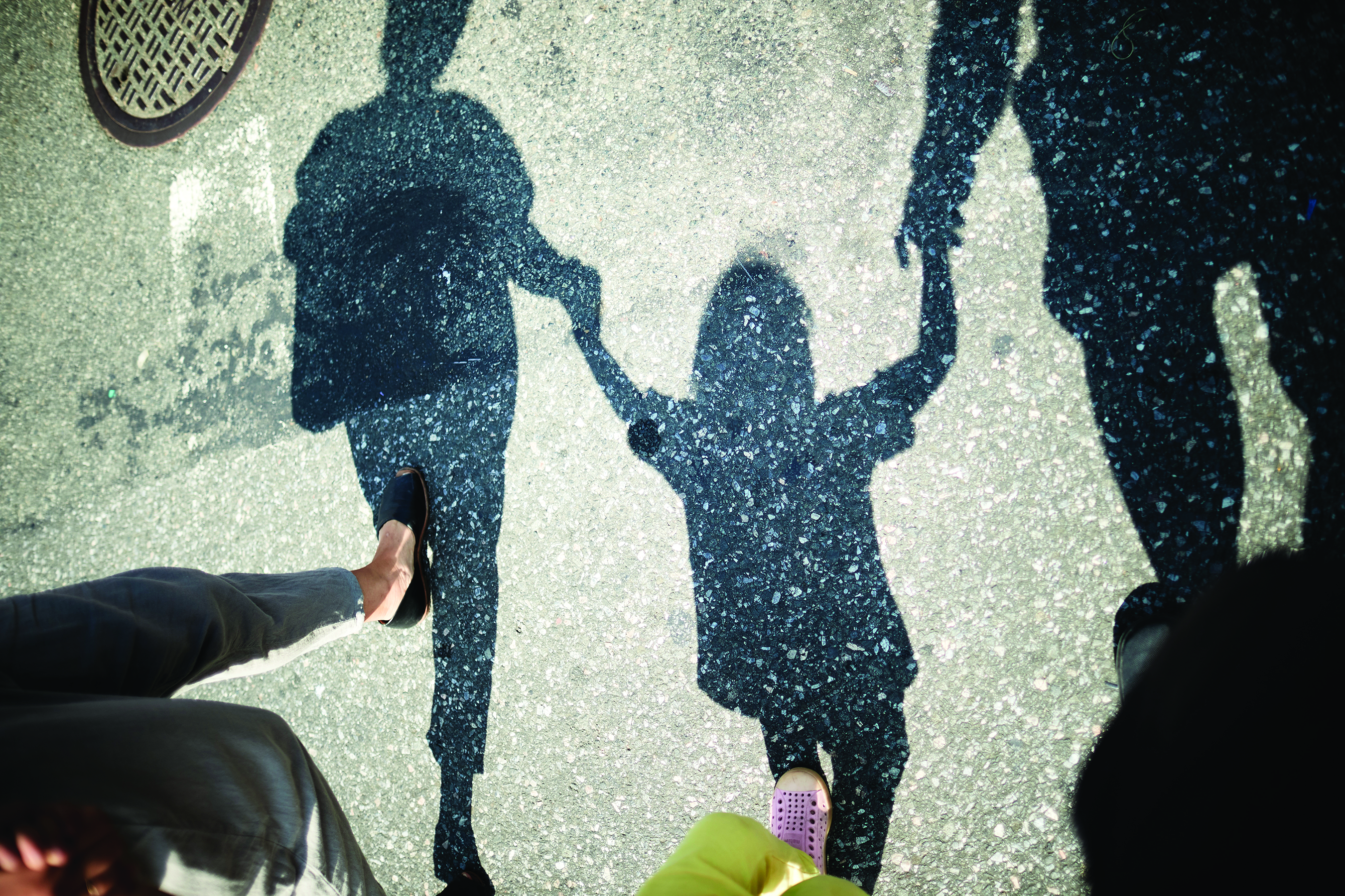 image showing a families shadow while walking.