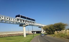 This is an image of a rail line train car above a road