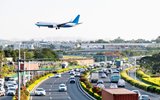 airplane landing over traffic