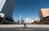 Bicycler in bicycle Lane next to road and sidewalk