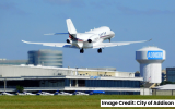 Plane taking off at Addison Airport